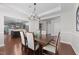 Dining Room has hardwood floors and crown molding and is open to kitchen at 120 Silver Bluff St, Holly Springs, NC 27540