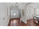Bright foyer boasts hardwood floors, a tray ceiling, and clear view to dining room at 120 Silver Bluff St, Holly Springs, NC 27540