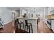 Kitchen with granite countertops, bar seating and stainless steel appliances at 120 Silver Bluff St, Holly Springs, NC 27540
