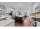 Open kitchen features stainless appliances, island with seating, and an open floor plan at 120 Silver Bluff St, Holly Springs, NC 27540