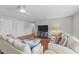 Inviting living room with neutral tones, hardwood floors, and stylish furniture arrangement at 120 Silver Bluff St, Holly Springs, NC 27540