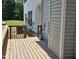Back porch area featuring brown wooden slats and the side of the house at 121 Brentfield Loop, Morrisville, NC 27560