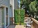Inviting back porch with chairs and a decorative screen providing privacy and shade at 121 Brentfield Loop, Morrisville, NC 27560