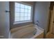 Bathtub in neutral bathroom with shower attachment at 121 Brentfield Loop, Morrisville, NC 27560