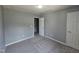 This spacious bedroom features neutral walls and carpet, with natural light and ample closet space at 121 Brentfield Loop, Morrisville, NC 27560