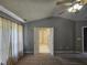 Bedroom with neutral walls, carpeting, and large closet; doors open to hallway at 121 Brentfield Loop, Morrisville, NC 27560