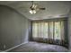 Bright bedroom featuring neutral walls and plush carpeting with large sunny windows at 121 Brentfield Loop, Morrisville, NC 27560