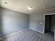 This well-lit bedroom offers plush carpeting, neutral paint, and versatile space at 121 Brentfield Loop, Morrisville, NC 27560