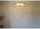 Photo showcases the elegant chandelier, adding a touch of sophistication to the neutral wall at 121 Brentfield Loop, Morrisville, NC 27560