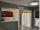 Bright dining area featuring hardwood floors with a door to the backyard and an open kitchen at 121 Brentfield Loop, Morrisville, NC 27560