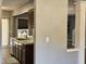 A kitchen sink with stainless steel appliances and a gray accent wall at 121 Brentfield Loop, Morrisville, NC 27560