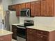 A kitchen with stainless steel appliances, white subway tile backsplash, and ample counter space at 121 Brentfield Loop, Morrisville, NC 27560