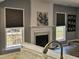 A well-lit fireplace and windows showing the bright living space at 121 Brentfield Loop, Morrisville, NC 27560