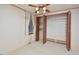Bedroom closet with slatted doors open to shelving and clothes rod at 124 Jack Bennett Rd, Chapel Hill, NC 27517