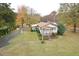 Charming single story home with a well-manicured lawn, mature trees and inviting front porch at 124 Jack Bennett Rd, Chapel Hill, NC 27517
