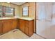 Laminate countertops and vintage wood cabinets in kitchen view with back door at 124 Jack Bennett Rd, Chapel Hill, NC 27517