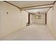 Living room with beige carpeting, neutral walls, and view into another room at 124 Jack Bennett Rd, Chapel Hill, NC 27517