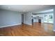 Inviting living room showcasing hardwood floors, neutral paint, and plenty of natural light with an open-concept layout at 1344 Highland Dr, Wake Forest, NC 27587