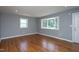 Bright living room featuring hardwood floors, neutral paint, a bay window and ample natural light at 1344 Highland Dr, Wake Forest, NC 27587
