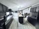Modern kitchen with stainless steel appliances and a large kitchen island with counter seating at 1404 N N Nc Hwy 87, Elon, NC 27244