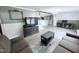 Well-lit living room with a comfortable seating arrangement, offering a relaxing space at 1404 N N Nc Hwy 87, Elon, NC 27244