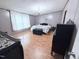 Cozy main bedroom with a stylish chandelier and dark wood floors at 1404 N N Nc Hwy 87, Elon, NC 27244