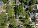 Aerial view showcasing the property's boundaries amid lush greenery and neighborhood streets at 1600 Pineview St, Raleigh, NC 27608