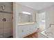 Bright bathroom with a walk-in shower, dual sinks, and a large mirror for a refreshing experience at 1600 Pineview St, Raleigh, NC 27608