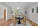 Cozy dining room with a round table, woven chairs, and views of the front door, providing a welcoming atmosphere at 1600 Pineview St, Raleigh, NC 27608