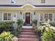 Inviting brick front steps lead to a beautiful wood front door at 1600 Pineview St, Raleigh, NC 27608