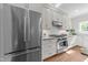 Modern kitchen with stainless steel appliances, white cabinets, subway tile backsplash and an efficient layout at 1600 Pineview St, Raleigh, NC 27608
