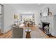 Bright living room features a fireplace, built-in bookshelves, and lots of natural light, perfect for relaxing or entertaining at 1600 Pineview St, Raleigh, NC 27608