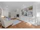 Bright living room featuring custom built-ins and an elegant armchair for a cozy feel at 1600 Pineview St, Raleigh, NC 27608