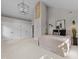 Large main bedroom with vaulted ceiling, modern lighting and a decorative stone column at 1600 Pineview St, Raleigh, NC 27608