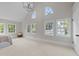 Sunlit main bedroom with large windows and stylish lighting creates a calming atmosphere at 1600 Pineview St, Raleigh, NC 27608