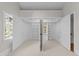 Open and walk-in closet features custom shelving and a center window for natural light at 1600 Pineview St, Raleigh, NC 27608