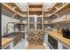 Walk-in pantry with wood countertops, shelving, wine rack, and stainless sink at 1600 Sweetwater Ln, Raleigh, NC 27610