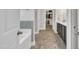 Bathroom featuring tile flooring, a double sink vanity, and a walk-in closet at 175 Steep Rock Dr, Willow Springs, NC 27592