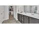 Bathroom featuring tile flooring, a double sink vanity, and a walk-in closet at 175 Steep Rock Dr, Willow Springs, NC 27592
