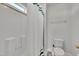 Full bathroom featuring a shower with a white shower curtain, toilet, and neutral colors at 175 Steep Rock Dr, Willow Springs, NC 27592