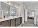 Bathroom featuring tile flooring, a double sink vanity, and a walk-in closet at 175 Steep Rock Dr, Willow Springs, NC 27592