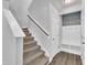 Entryway with stairs and built in bench and hooks for storage at 175 Steep Rock Dr, Willow Springs, NC 27592