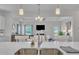 Well-lit kitchen featuring a large island with a sink that overlooks the living room for easy communication at 175 Steep Rock Dr, Willow Springs, NC 27592