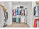 Walk-in closet with carpeted floors and multiple hanging racks at 175 Steep Rock Dr, Willow Springs, NC 27592