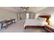 Bedroom with a bed, ceiling fan, neutral carpeting, and lots of natural light at 1880 Woodall Crest Dr, Apex, NC 27502
