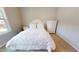 Cozy bedroom featuring a bed with white linens, a nightstand, and a dresser at 1880 Woodall Crest Dr, Apex, NC 27502