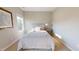 Well-lit bedroom with neutral walls, a bed, and two windows providing ample natural light at 1880 Woodall Crest Dr, Apex, NC 27502