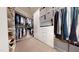 Spacious walk-in closet with custom shelves, rods, and drawers for optimal organization at 1880 Woodall Crest Dr, Apex, NC 27502
