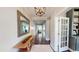 Inviting foyer with hardwood floors, light fixture and convenient drop zone at 1880 Woodall Crest Dr, Apex, NC 27502