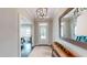 Welcoming foyer with hardwood floors, a light rug, and a view into the dining and living areas at 1880 Woodall Crest Dr, Apex, NC 27502